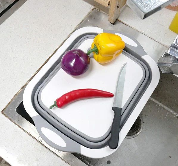 Board folding up into a strainer basket