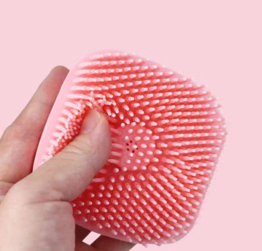 Brush detangling wet hair in the shower