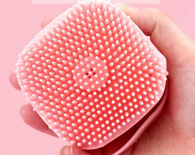 Silicone bristles reaching through hair to the scalp