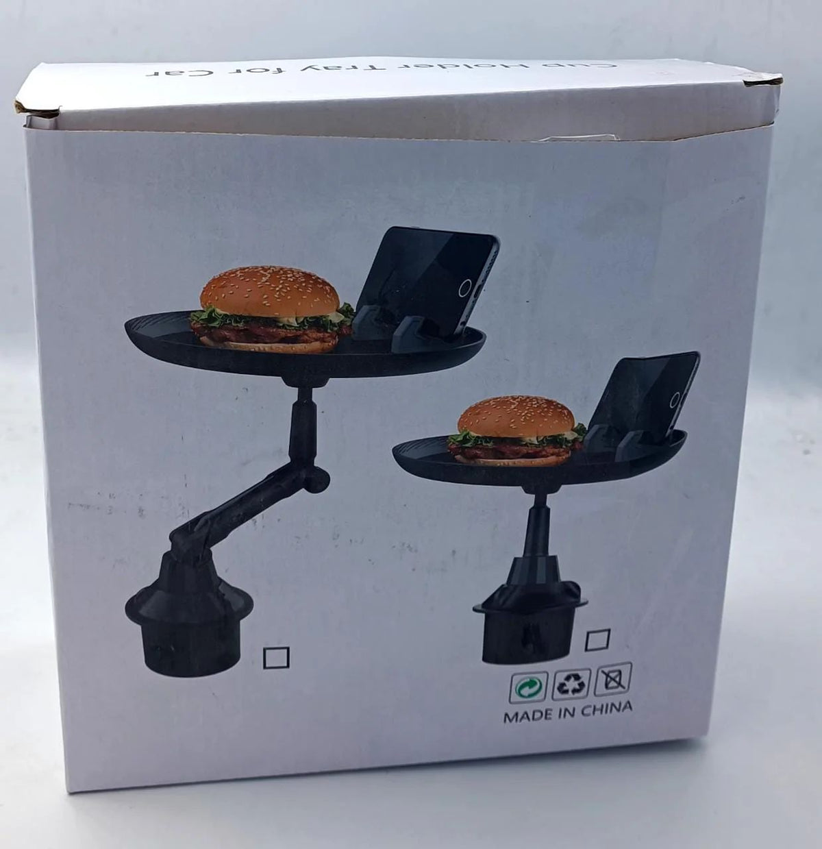 Tray holding drinks, food and a phone