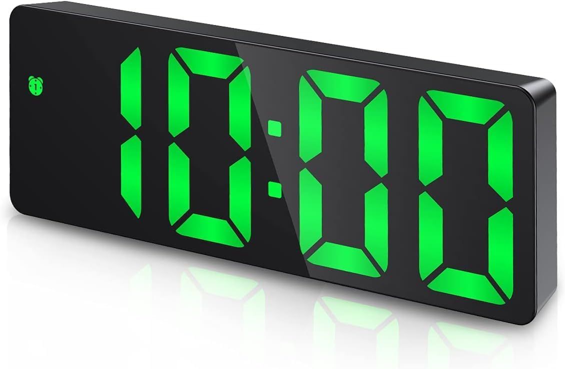 Digital clock shown with dimensions