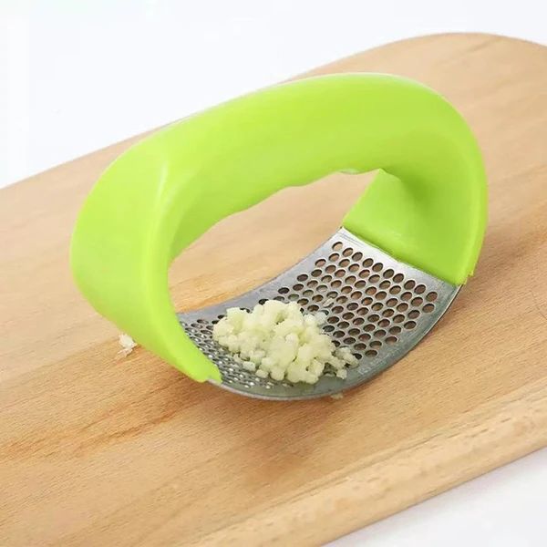 Garlic press shown with dimensions