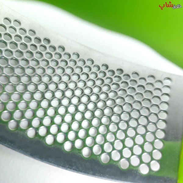Garlic press in use in a kitchen