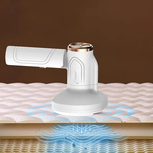 Lightweight vacuum held at an angle on a mattress