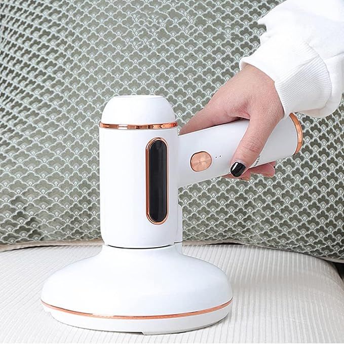 Handheld vacuum cleaning a carpet edge