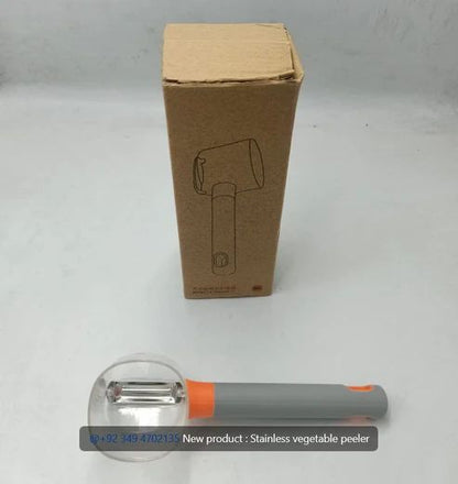 Wide blade vegetable peeler with catch container