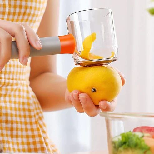 Vegetable peeler container being emptied